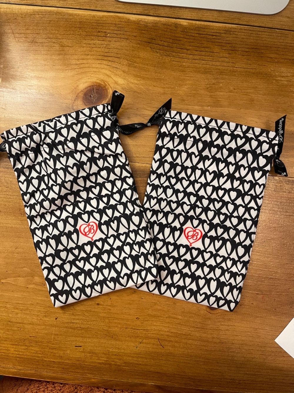 LgBrighton Black & White Heart Print Drawstring Pouches w/ Red Logo. 2 available